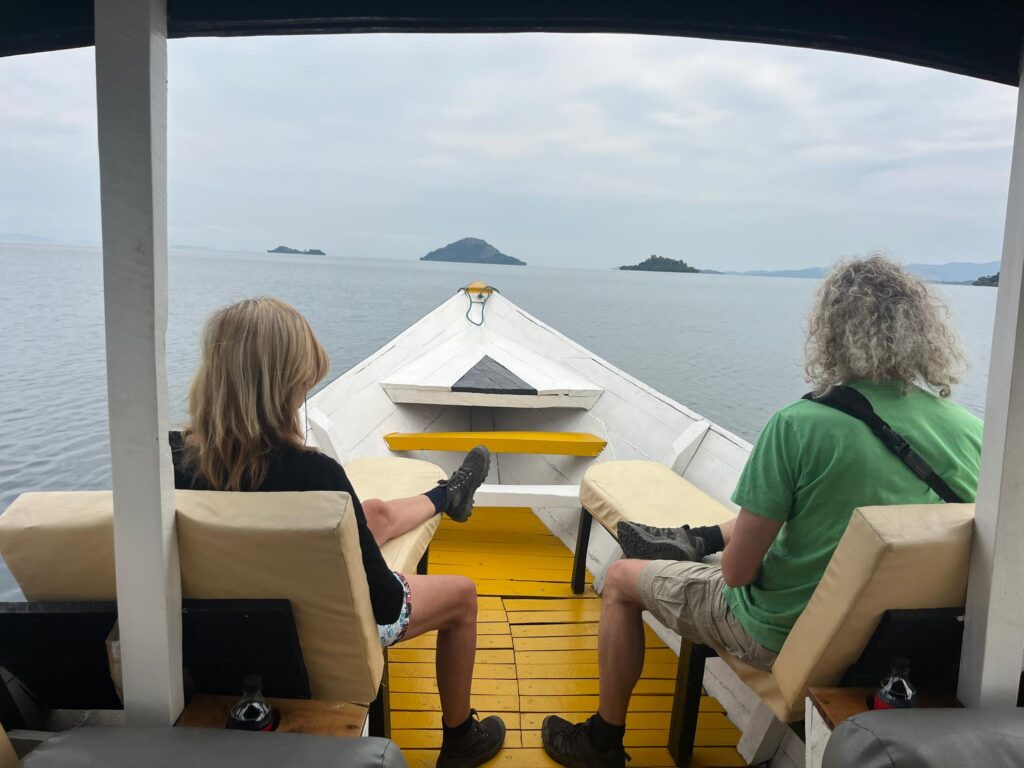 Two tourist enjoying lake kivu by discover lake kivu
